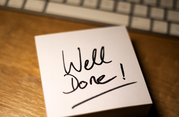 A photo of a note that reads ‘Well done!’