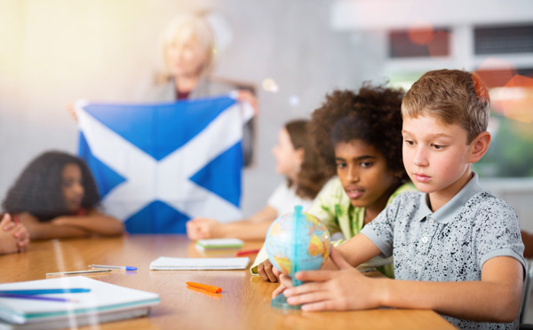 A photo of young children in a Scottish classroom.