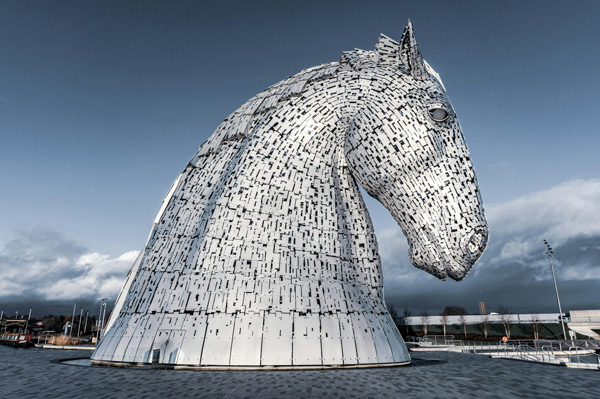 A photo of a large sculpture of a horse’s head.