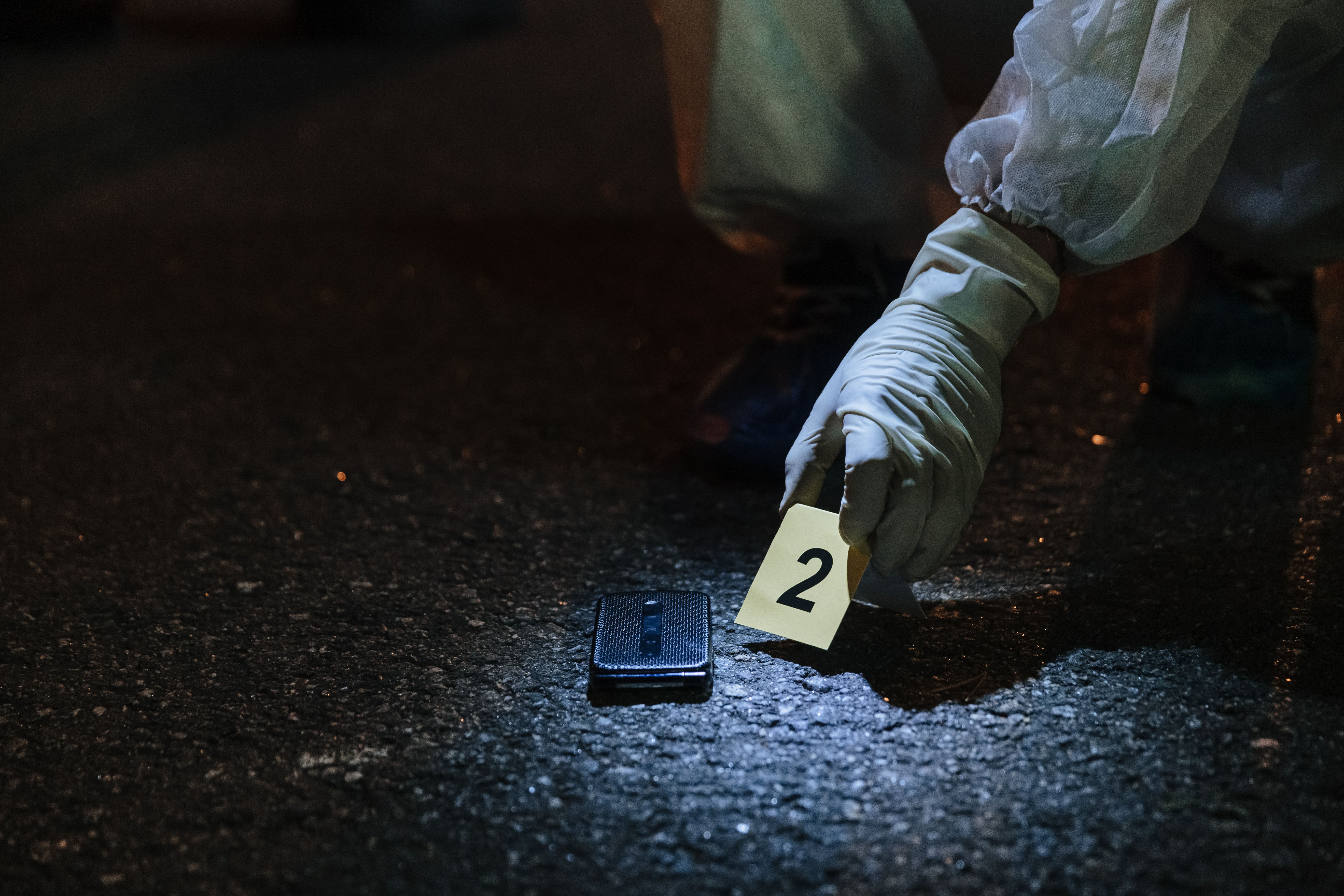 Forensic's laying down evidence tag number